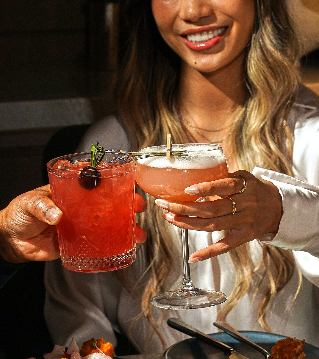 Guest enjoying a cocktail at a Sheraton Centre Toronto bar